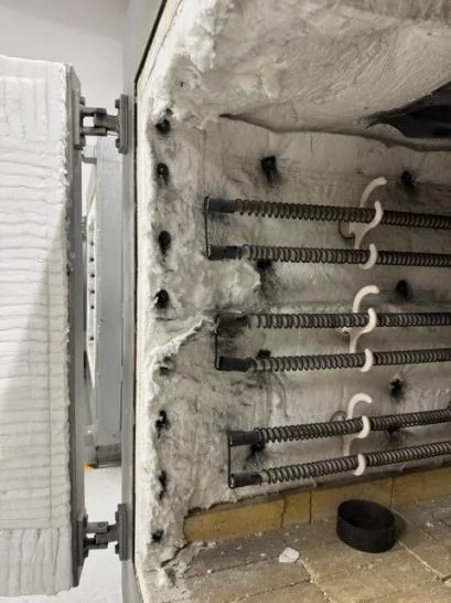 Oven interior lining breaking down around the heating elements before repair