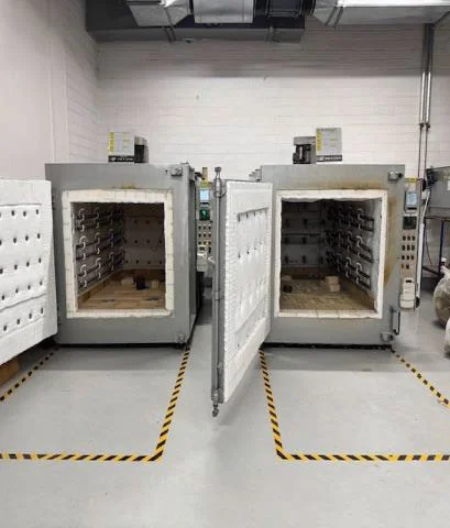 Two aerospace heat treatment ovens relined, with new door insulation in place